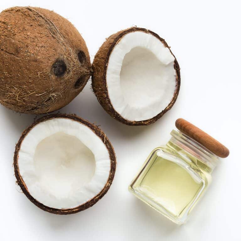 coconut and coconut oil in a white background