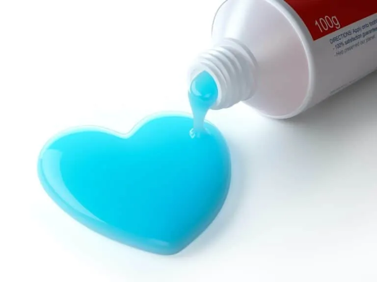 Toothpaste in the shape of heart coming out from toothpaste tube