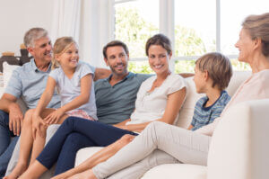 White family seated at couch