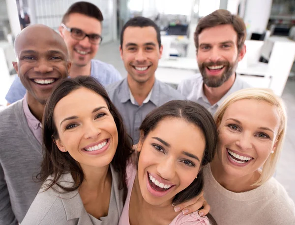 A group of individuals smiling